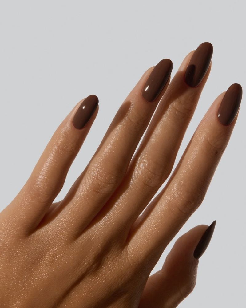medium long almond nails plain classic chocolate brown ultra glossy no shimmer no art clean grey background