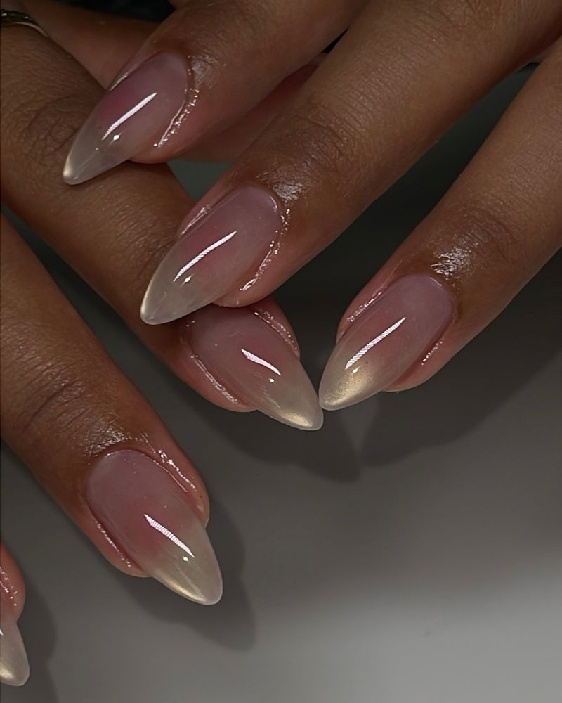 long stiletto jelly nails in sheer nude fading to a pearlescent tip